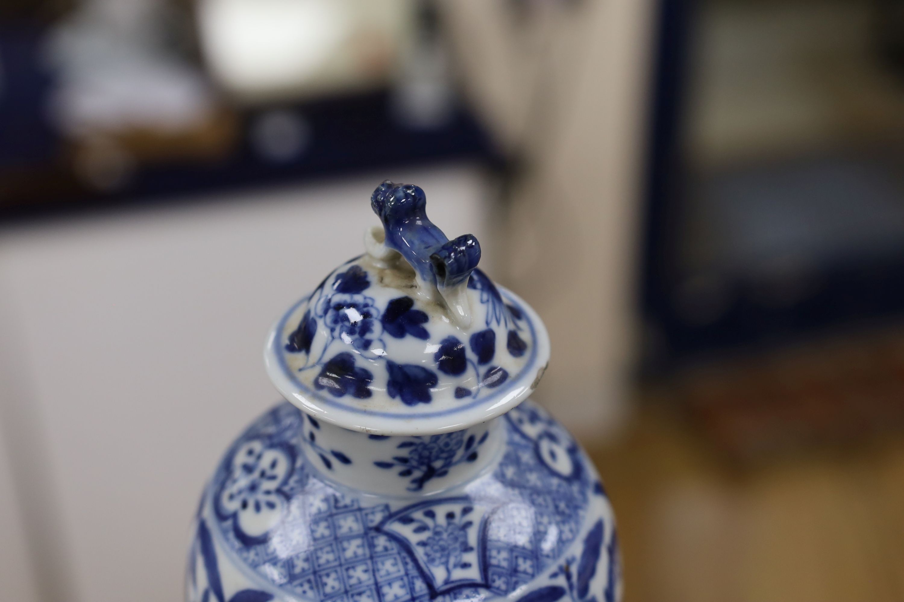 A pair of Chinese blue and white dragon vases and covers, circa 1900. 28cm